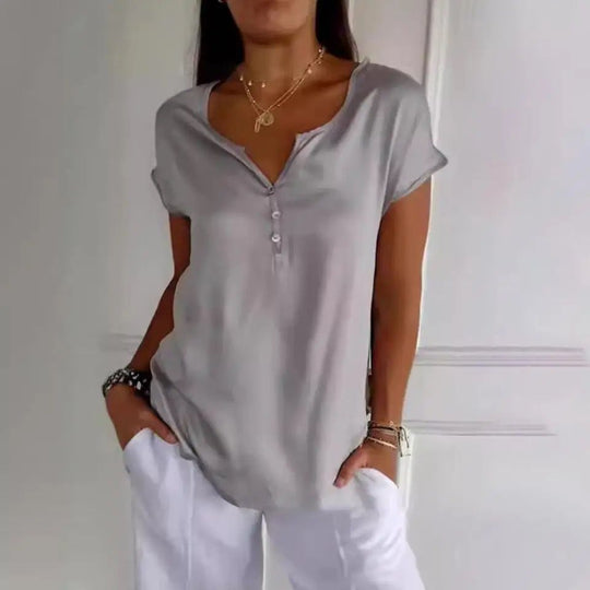 Elegante top Dames | V-hals & knoopdetails