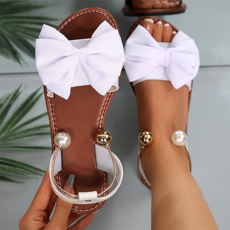 Jaxoria - Vrouwen platte sandalen met decoratieve strik en parels 5