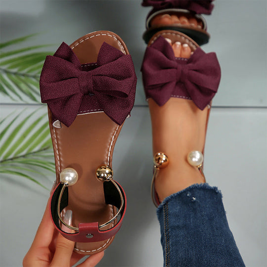 Jaxoria - Vrouwen platte sandalen met decoratieve strik en parels 6